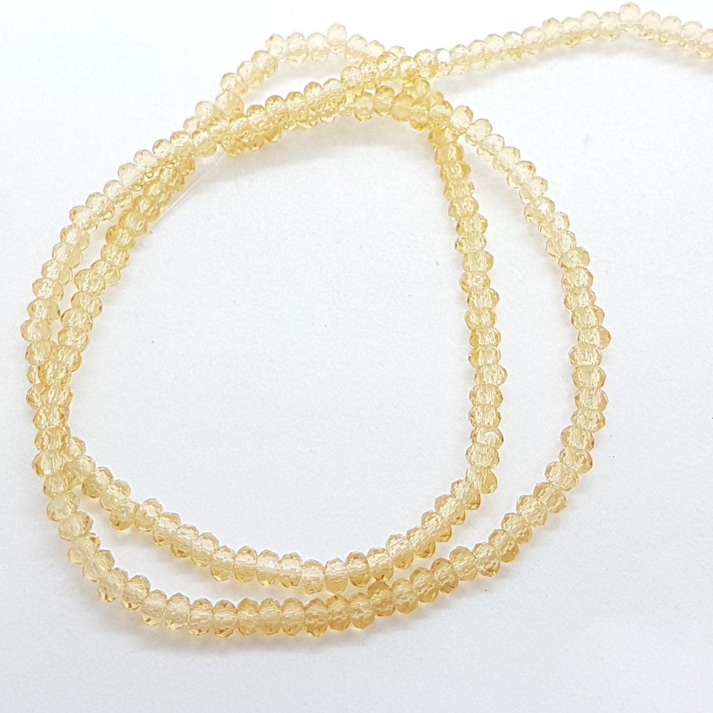 Tiny Crystal Golden Rondelle Beads Approx 200 beads