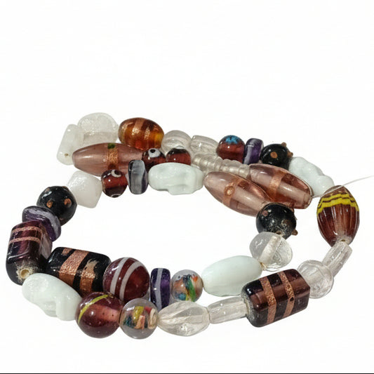 38pc Clear, purple & Skulls Lampwork Bead String